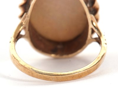 Lot 19 - A 9ct opal ring, the oval opal cabochon,...