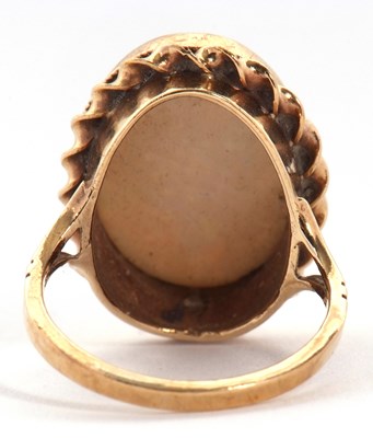 Lot 19 - A 9ct opal ring, the oval opal cabochon,...