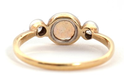 Lot 81 - An opal and diamond ring, the round opal...