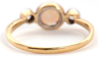 Lot 81 - An opal and diamond ring, the round opal...