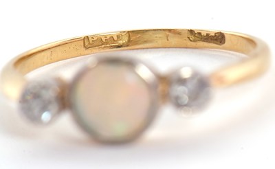 Lot 81 - An opal and diamond ring, the round opal...