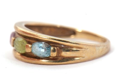 Lot 77 - A 9ct multi gemset ring, with topaz, peridot,...