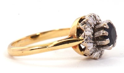 Lot 65 - A sapphire and diamond cluster ring, the...