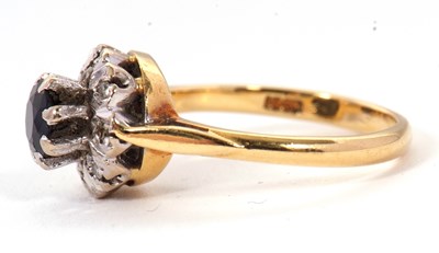 Lot 65 - A sapphire and diamond cluster ring, the...