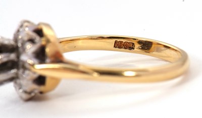 Lot 65 - A sapphire and diamond cluster ring, the...