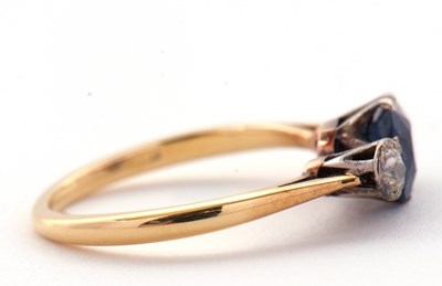 Lot 4 - A sapphire and diamond ring, the central pale...