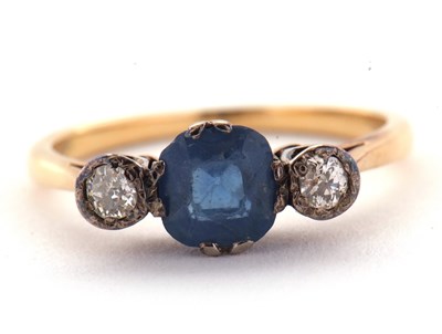 Lot 4 - A sapphire and diamond ring, the central pale...
