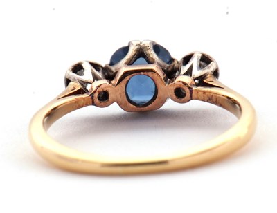 Lot 4 - A sapphire and diamond ring, the central pale...