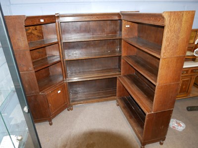 Lot 680 - An unusual Minty oak three section corner...