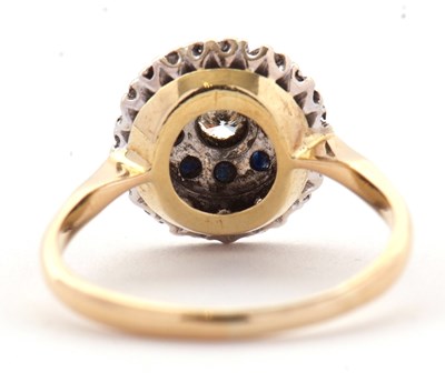 Lot 33 - A sapphire and diamond cluster ring, the...