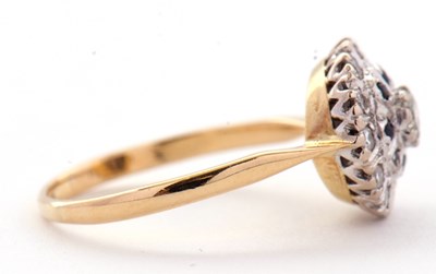 Lot 33 - A sapphire and diamond cluster ring, the...