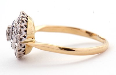 Lot 33 - A sapphire and diamond cluster ring, the...