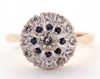 Lot 33 - A sapphire and diamond cluster ring, the...