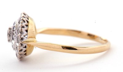 Lot 33 - A sapphire and diamond cluster ring, the...