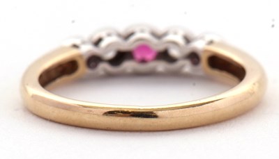 Lot 32 - A 9ct ruby and diamond ring, the alternating...
