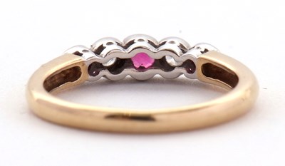 Lot 32 - A 9ct ruby and diamond ring, the alternating...