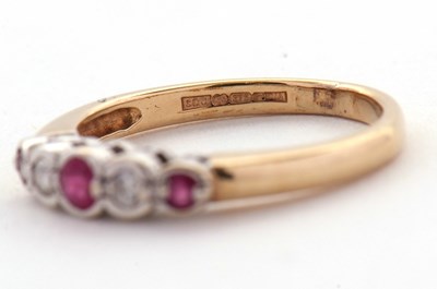 Lot 32 - A 9ct ruby and diamond ring, the alternating...