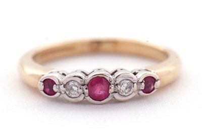 Lot 32 - A 9ct ruby and diamond ring, the alternating...