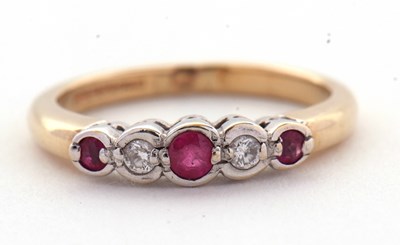 Lot 32 - A 9ct ruby and diamond ring, the alternating...