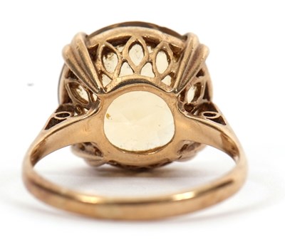 Lot 36 - A 9ct citrine ring, the round faceted citirine,...