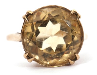 Lot 36 - A 9ct citrine ring, the round faceted citirine,...