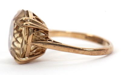Lot 36 - A 9ct citrine ring, the round faceted citirine,...