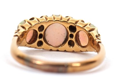 Lot 12 - An opal and diamond ring, the three slightly...