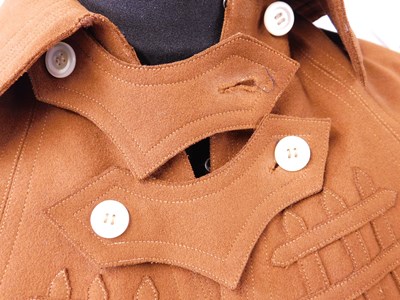 Lot 13 - An early 20th century lady's brown felt cape,...
