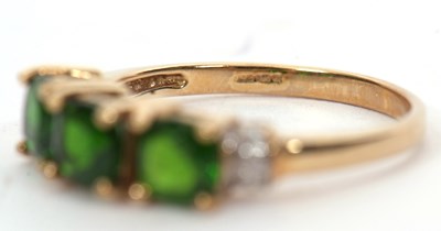 Lot 16 - A 9ct diopside and white stone ring, the three...