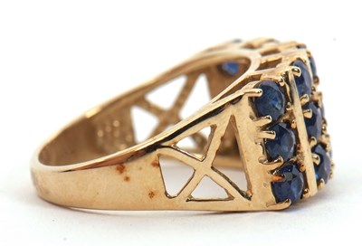 Lot 10 - A 9ct stone blue gemset ring, the three rows...
