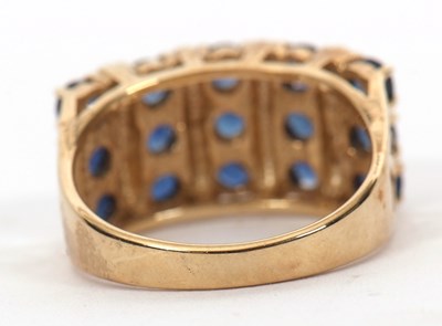 Lot 10 - A 9ct stone blue gemset ring, the three rows...