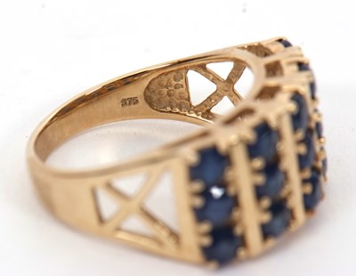 Lot 10 - A 9ct stone blue gemset ring, the three rows...
