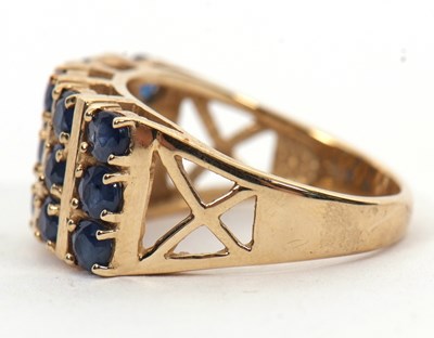 Lot 10 - A 9ct stone blue gemset ring, the three rows...