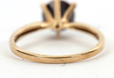 Lot 5 - A 9ct black diamond ring, the round brilliant...