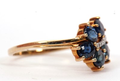 Lot 7 - A 9ct blue stone and diamond ring, the leaf...