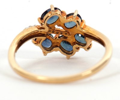 Lot 7 - A 9ct blue stone and diamond ring, the leaf...