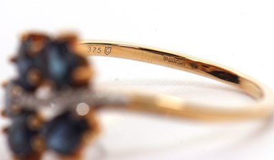 Lot 7 - A 9ct blue stone and diamond ring, the leaf...
