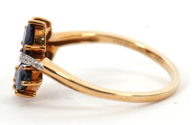 Lot 7 - A 9ct blue stone and diamond ring, the leaf...