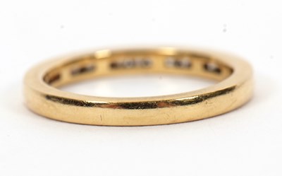 Lot 46 - An 18ct diamond half hoop ring, channel set...