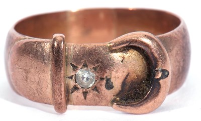 Lot 6 - 9ct rose gold buckle ring highlighted with a...