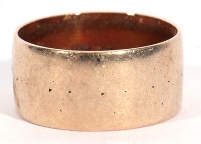 Lot 18 - 9ct gold wide band wedding ring of plain and...