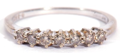 Lot 31 - 9ct white gold seven stone diamond ring, line...