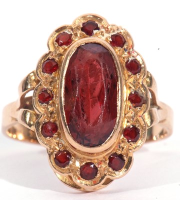 Lot 36 - Mid-grade yellow metal dress ring centring a...