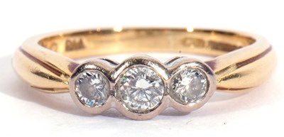 Lot 82 - 18ct gold three stone diamond ring featuring...