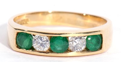 Lot 85 - 18ct gold emerald and diamond half hoop ring...