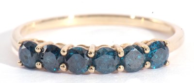 Lot 129 - Modern 9ct gold blue topaz ring, line set with...