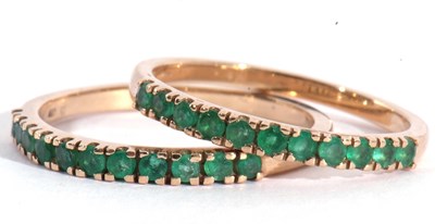 Lot 130 - Two modern 9ct gold and emerald half hoop...