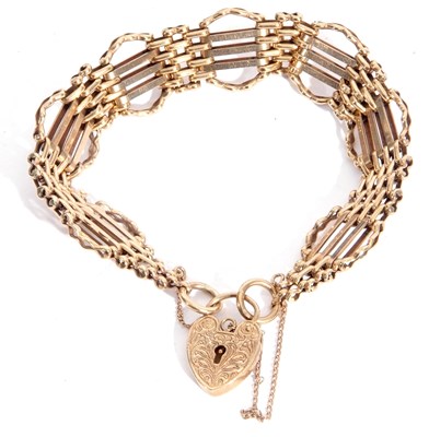 Lot 133 - 9ct gold gate bracelet featuring seven oval...