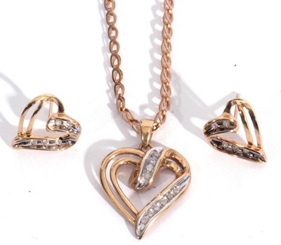 Lot 158 - Modern 10k stamped heart pendant of open work...