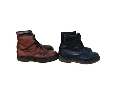 Lot 146 - Two pairs of Dr Martens boots: a pair of black...